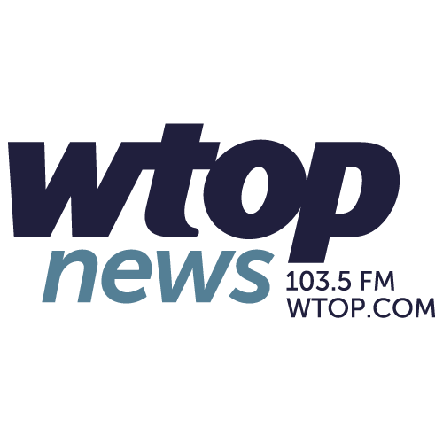 Logo for WTOP News featuring bold dark blue text "wtop," light blue text "news," and smaller dark blue text "103.5 FM WTOP.COM" on a white background.