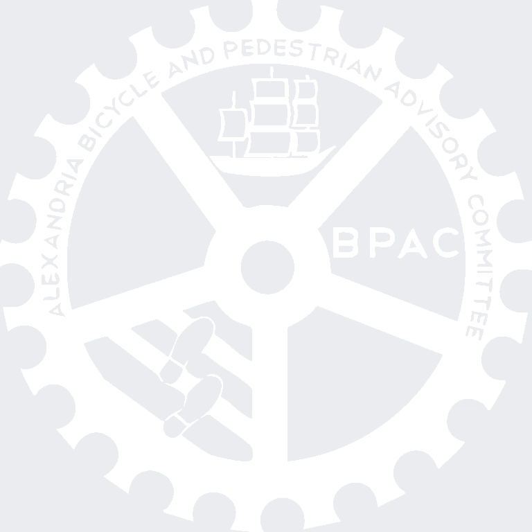 White gear with a ship and airplane design in the center and the text "Alexandria Bicycle and Pedestrian Advisory Committee" around the edge. The acronym "BPAC" appears to the right of the ship.