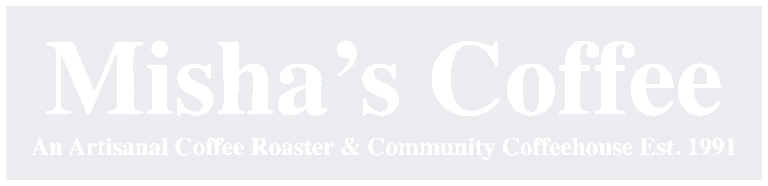 A sign reads: "Misha’s Coffee. An Artisanal Coffee Roaster & Community Coffeehouse Est. 1991" in white text on a light gray background.