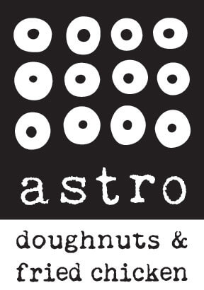 Nine white doughnut icons arranged in a 3x3 grid on a black background, with the text “astro doughnuts & fried chicken” in white, handwritten-style font below the icons.