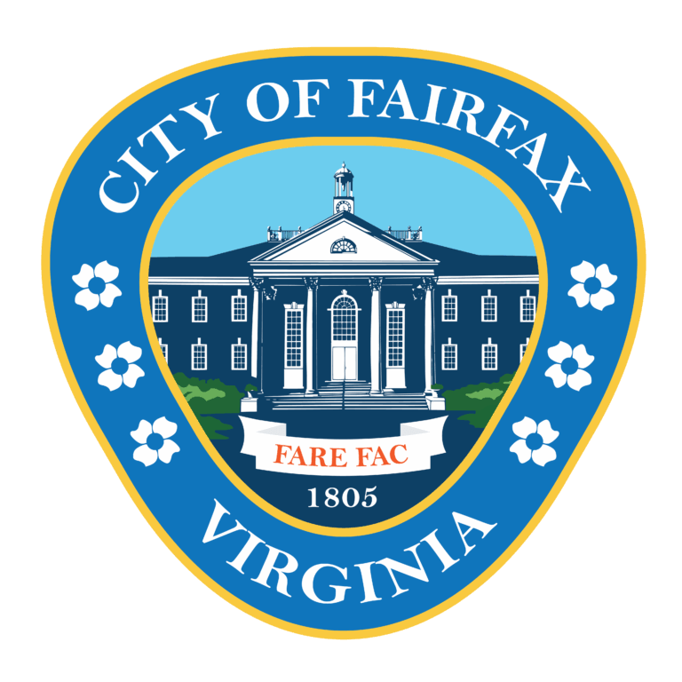 Blue and gold City of Fairfax, Virginia emblem featuring a white building, "Fare Fac" motto, "1805," and white flowers on a blue shield-shaped background.
