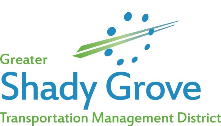 Logo for the Greater Shady Grove Transportation Management District featuring blue and green text and a graphic of green and blue lines with blue dots arranged in a circular pattern.