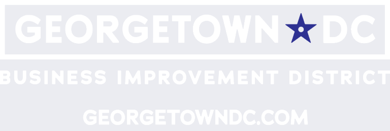 Logo with the text "GEORGETOWN DC" featuring a blue star inside the letter "O" in "DC," followed by "Business Improvement District" and "GEORGETOWNDC.COM" below.