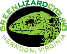 Logo for Green Lizard Cycling featuring a stylized green lizard head on a black background, with "GREEN LIZARD CYCLING" above and "HERNDON, VIRGINIA" below in green and white text.