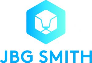 JBG SMITH logo featuring a blue hexagon with a white geometric lion head inside, above the company name "JBG SMITH" in bold blue capital letters.