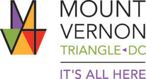 Logo for Mount Vernon Triangle, DC. The left features a geometric, multicolored "MVT" design in purple, green, orange, yellow, and red. The text reads: "Mount Vernon Triangle DC. It's All Here.
