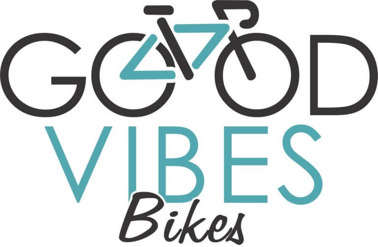 Logo for "Good Vibes Bikes" with "GOOD" in black, "VIBES" in teal, and "Bikes" in script. The two O’s in "GOOD" form bicycle wheels with a teal stylized bicycle frame above "VIBES.