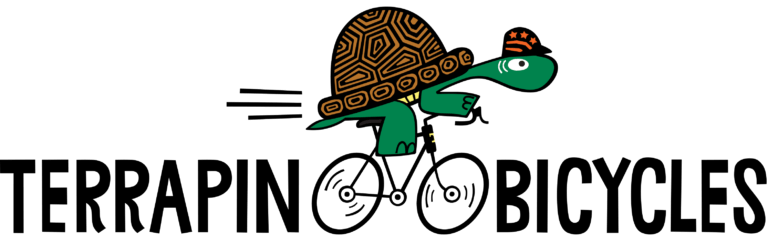 A cartoon turtle wearing a patterned shell and orange cap rides a bicycle, forming the "A" in "TERRAPIN BICYCLES" with its wheels replacing the letters "A" and "C".