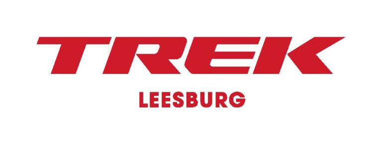 Red text on a white background reads "TREK" in large, bold letters with "LEESBURG" in smaller, bold letters below it.