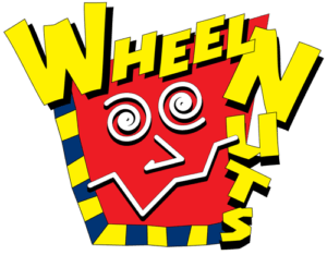 A colorful, playful logo with the words "Wheel Nuts" in bold yellow letters arranged around a red face with spiral eyes and a zigzag mouth, outlined with a blue and yellow border.