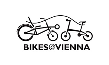 Logo for Bikes@Vienna featuring two stylized bicycles with a line above suggesting the outline of a car, and the text "BIKES@VIENNA" below in bold capital letters.